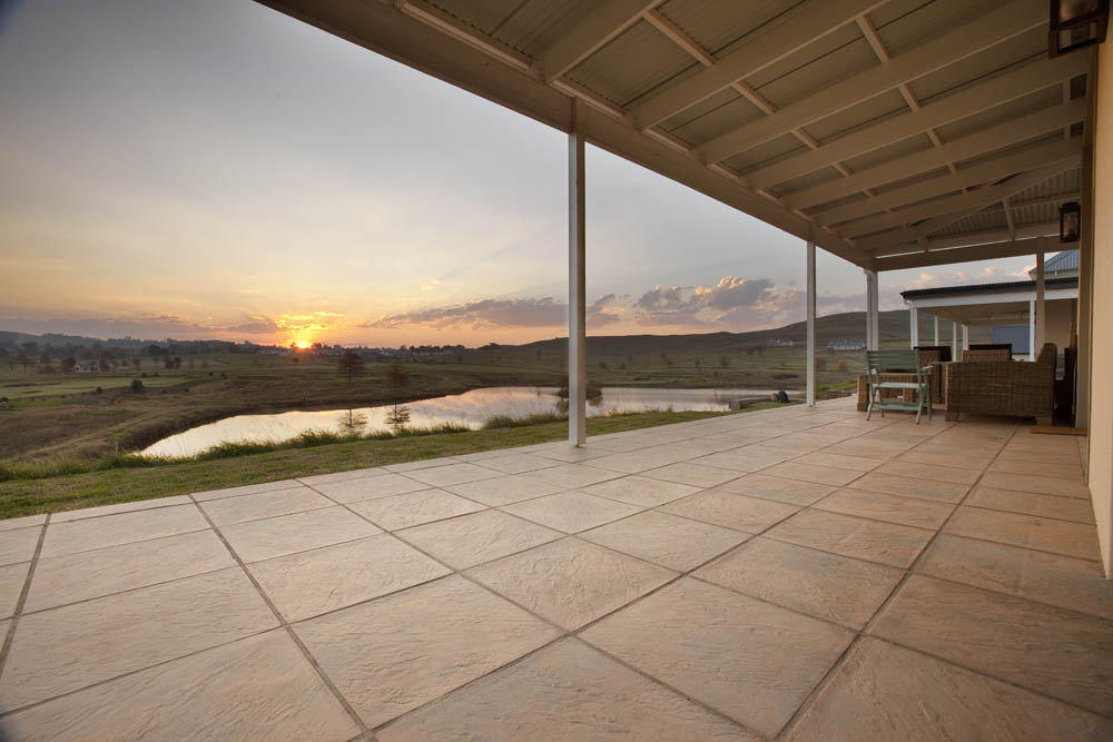 Beautiful raised patio with textured sandstone pavers