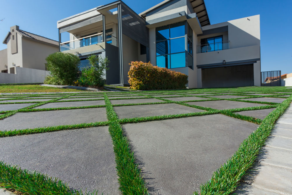Concrete flagstones with grass borders