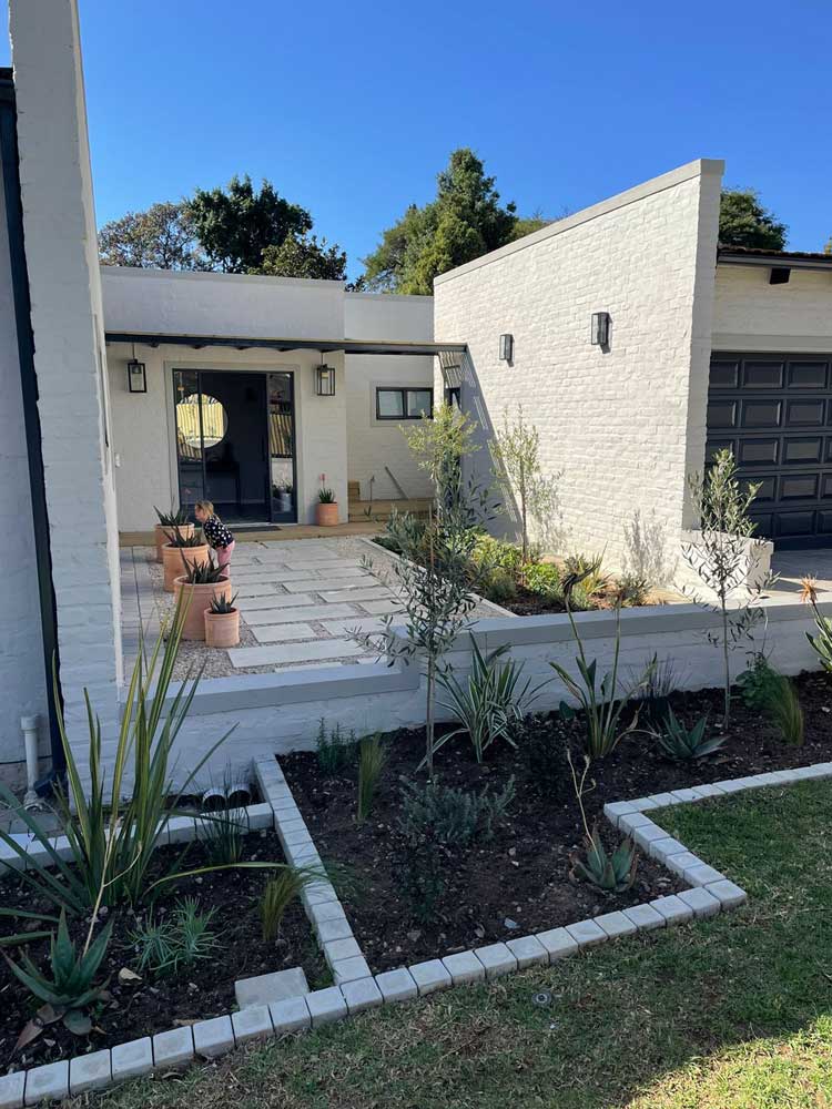 Flower bed edging created with cobbles