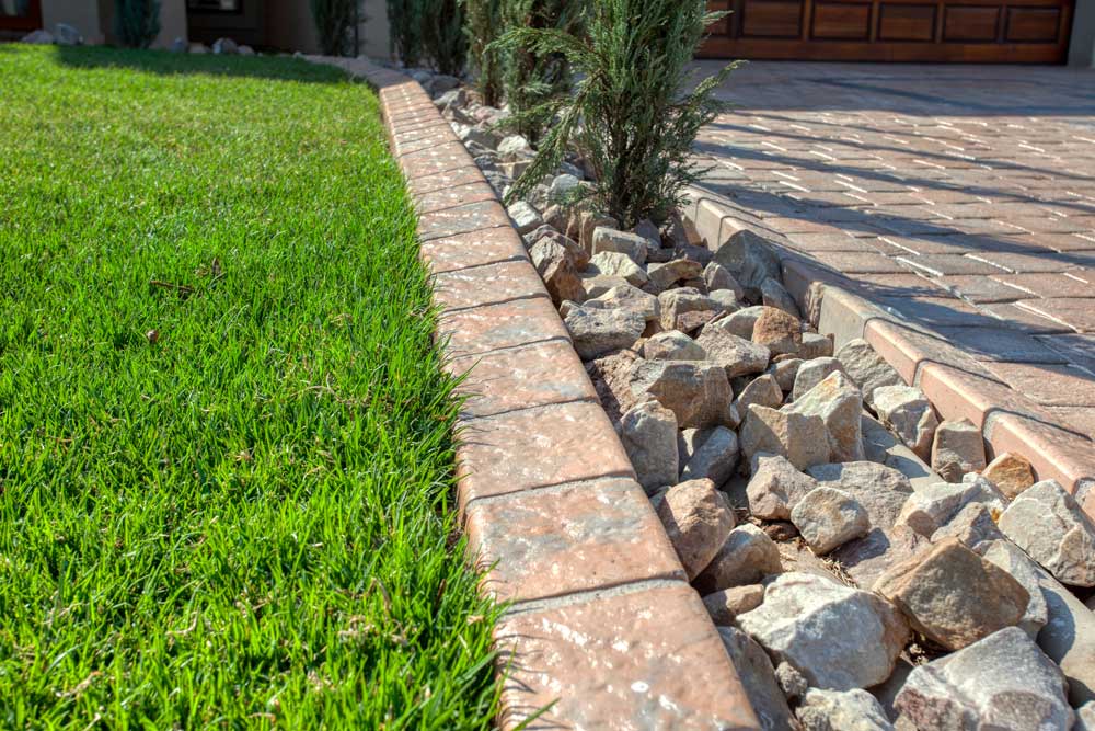 Garage edge restraint created with cobbles