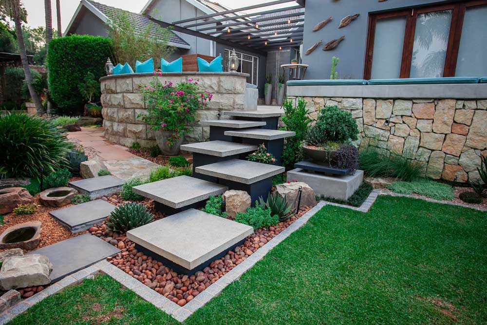 Garden borders around floating concrete tiles
