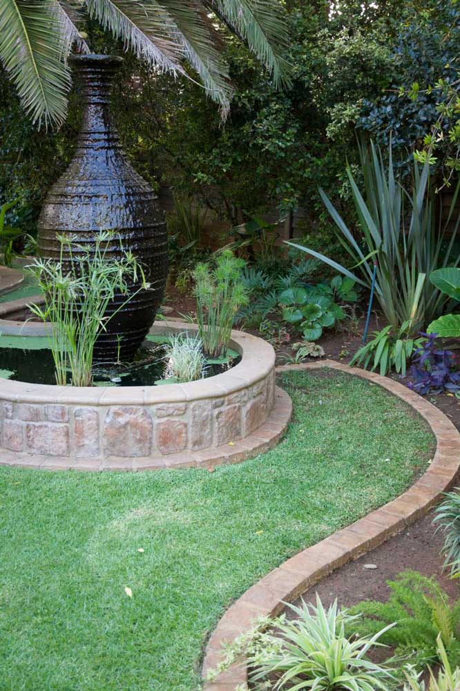Garden borders made of pavers used around a flower bed