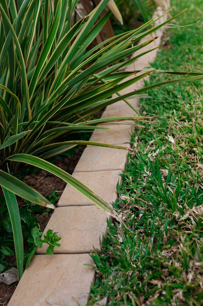 Garden edging restraint seperating landscape and garden