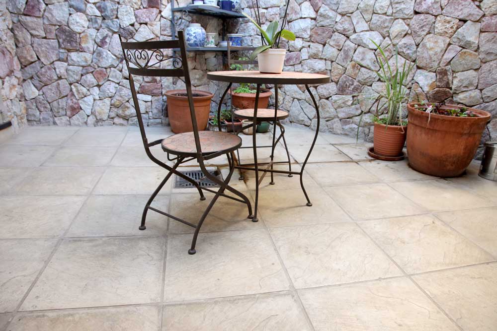 Estcourt Paver in a light blended colour installed at a small outdoor living space patio