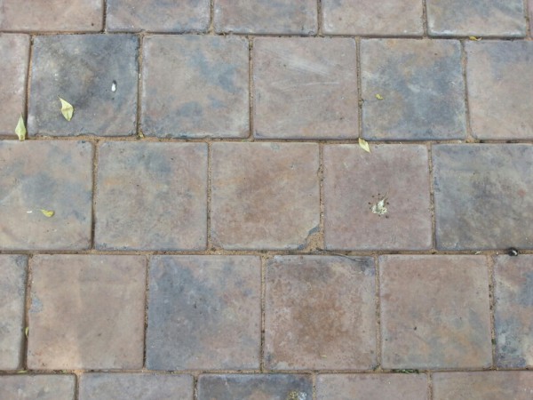 Paving failure due to careless handling of pavers which has caused chipping and breaking