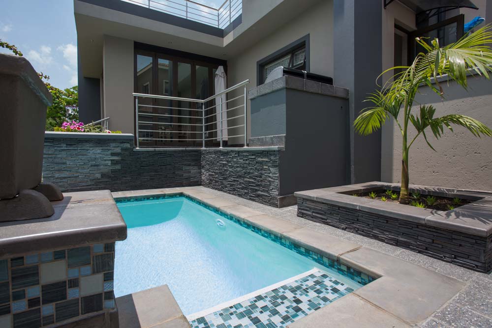 Newtown Coping in Grey ad Charcoal used at a pool and garden landscaping