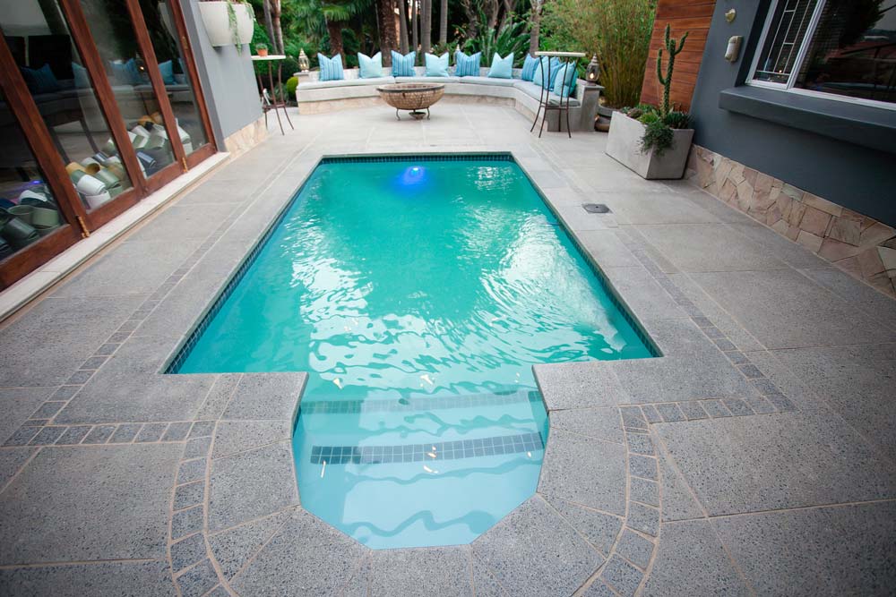 Polished Newtown Coping used around a Outdoor Living Pool